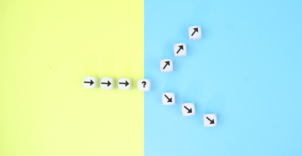 Illustration of a path that splits into two distinct directions at a decision point, symbolizing a critical organizational inflection point where choices determine the future course.